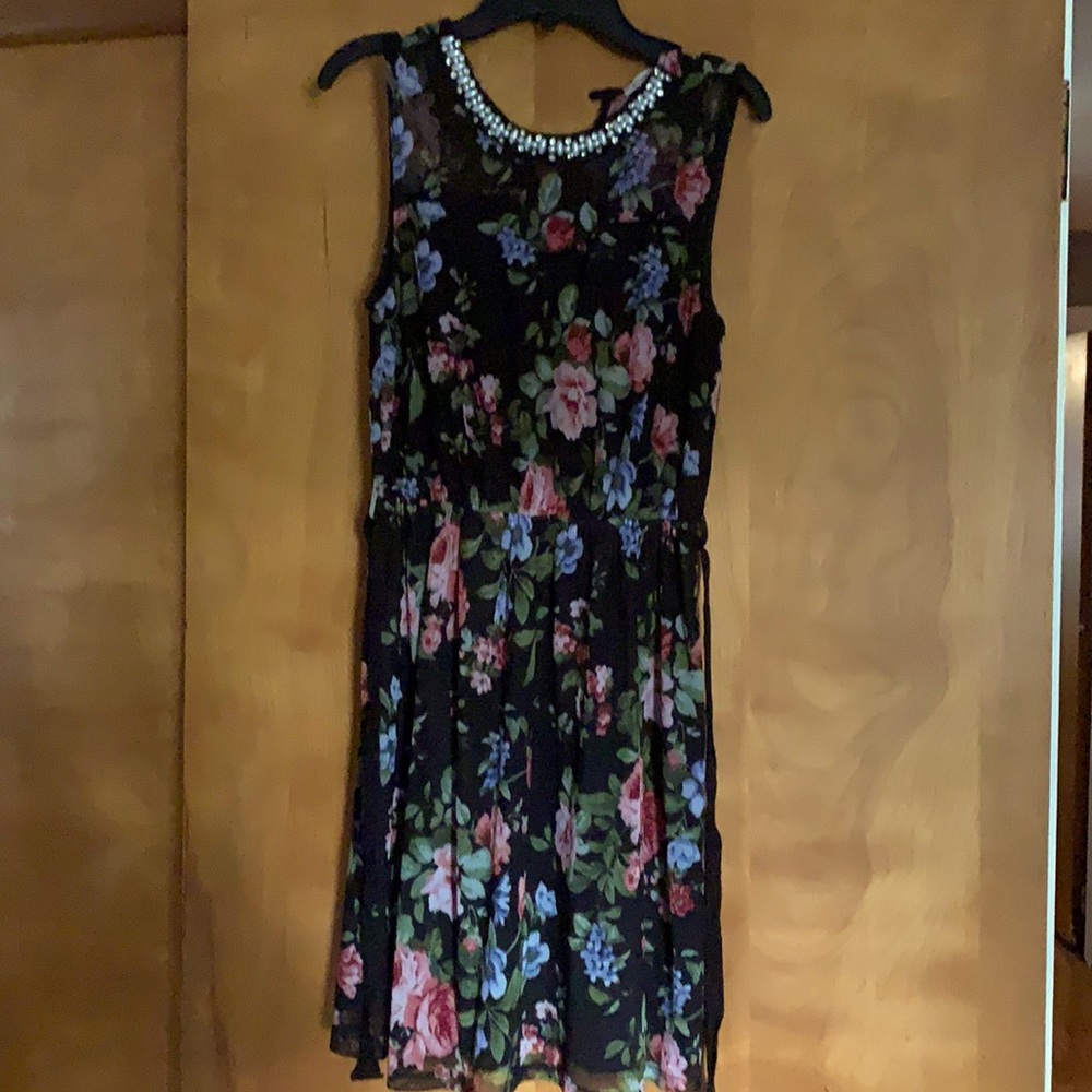 Cute floral girl Xl dress. Black with pink, blue and green flowers.